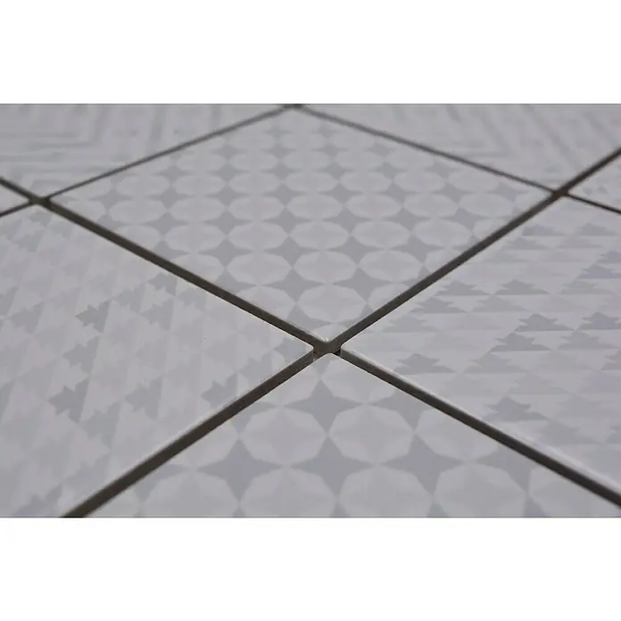 Mozaïektegel vierkant Retro GEOW - 29,8 x 29,8 cm, Wit, Glanzend - Close-up van witte, vierkante tegels met diverse grijze patronen, die een modern en elegant design laten zien.