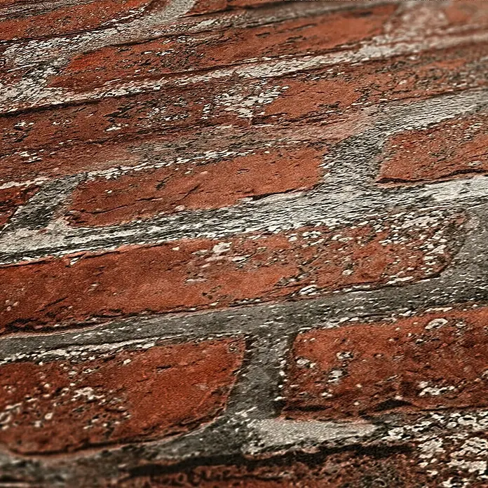 AS Creation Elements Vliestapete Steine III - Rot/Grau, Steinoptik, 10,05 x 0,53 m - Nahaufnahme einer Wand mit roten Backsteinen und grauen Fugen, die eine rustikale und industrielle Optik erzeugt. Das Mauerwerk verleiht Wärme und Charakter.