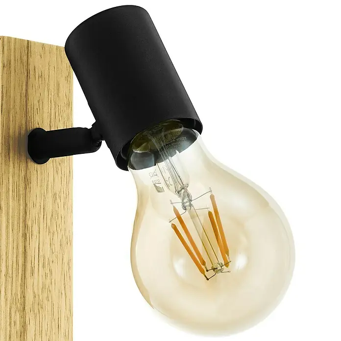 Eglo Townshend 3 LED-Wandleuchte - 10 W - Nahaufnahme einer modernen Wandleuchte mit Holzsockel und schwarzem Lampenschirm, die eine Edison-Glühbirne hervorhebt.\n
