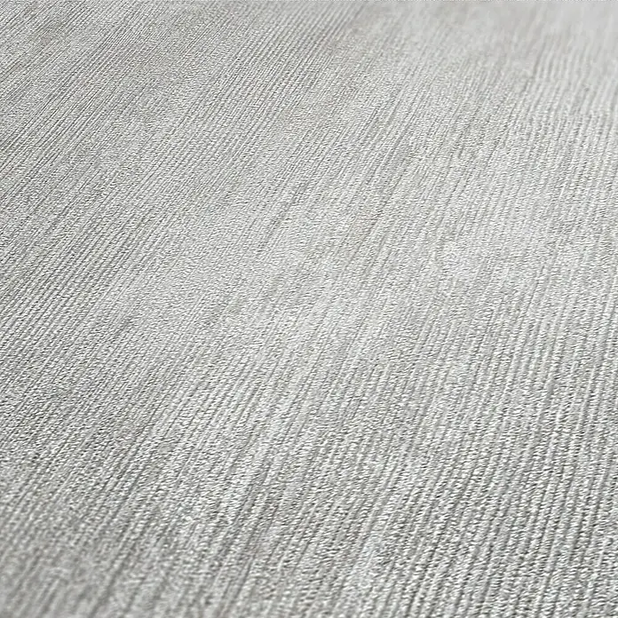 AS Creation Industrial Vliesbehang - Grijs, Uni, 10,05 x 0,53 m - Close-up van gestructureerd, zilverkleurig behang met fijne, lineaire details, dat een subtiel en elegant design laat zien.