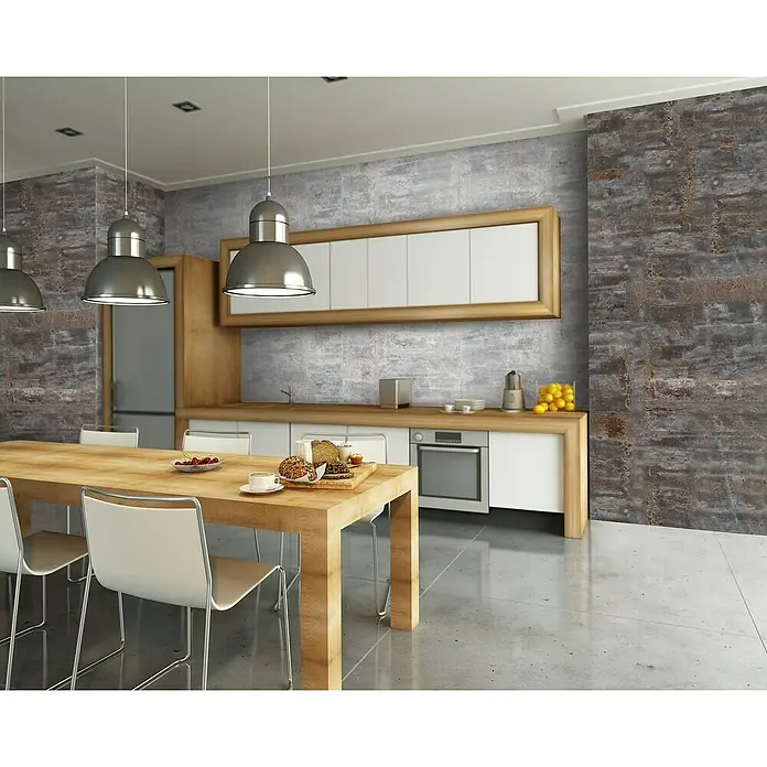Grosfillex Revestimiento de pared Element 3D Oxyde - L x An: 260 x 37,5 cm, Liso - Vista de la cocina con mesa de comedor de madera, sillas y lámparas colgantes. Electrodomésticos modernos y suelo gris.
