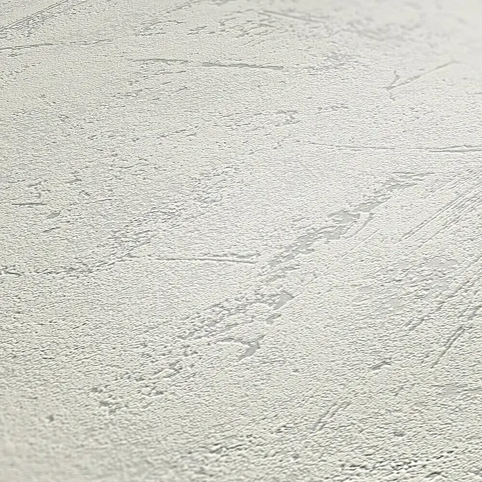 my look Vliestapete - Hellgrau, Uni, 10,05 x 0,53 m - Nahaufnahme einer weißen Wand mit rauer Putzstruktur, die ein rustikales und elegantes Aussehen verleiht. Ideal für moderne Innenräume.