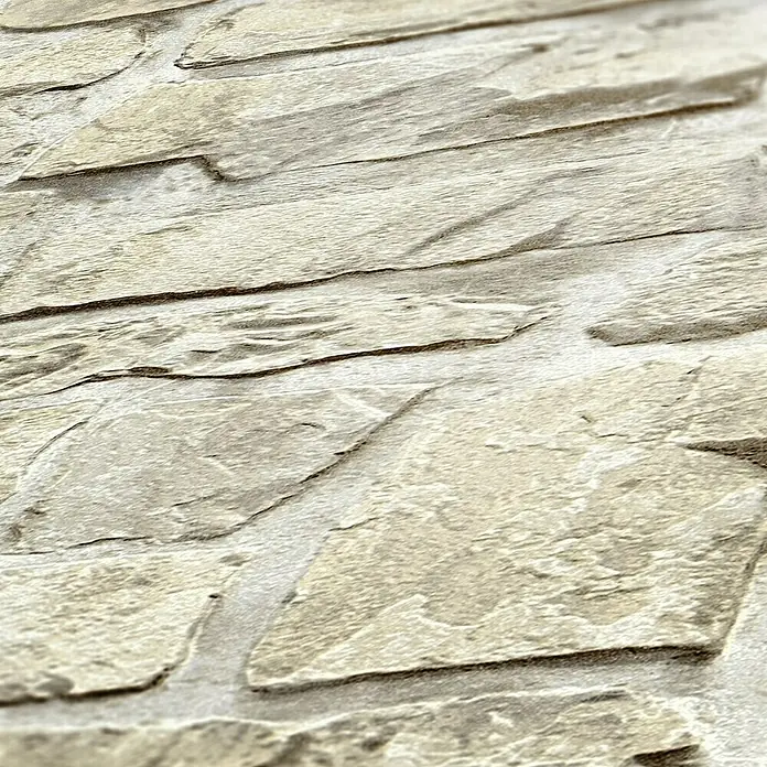my look Diamant Vliestapete - Beige, Steinoptik, 10,05 x 0,53 m - Nahaufnahme einer Wandverkleidung mit strukturierten Steinimitat-Paneelen in natürlichen Erdtönen. Die Oberfläche wirkt rau und detailreich.