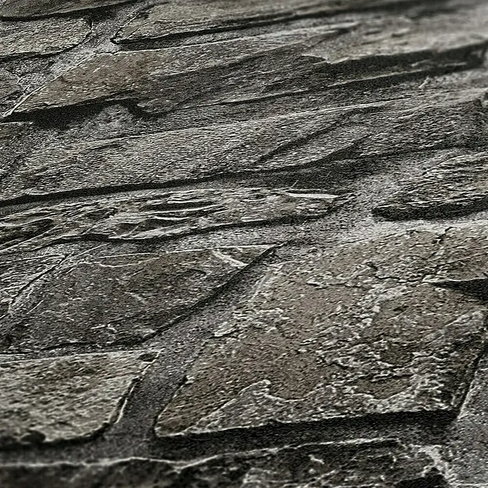 my look Diamant Vliestapete - Anthrazit, Steinoptik, 10,05 x 0,53 m - Nahaufnahme einer strukturierten Steinmauer mit rauher Oberfläche, die die natürliche Schönheit und Textur des Steins hervorhebt.