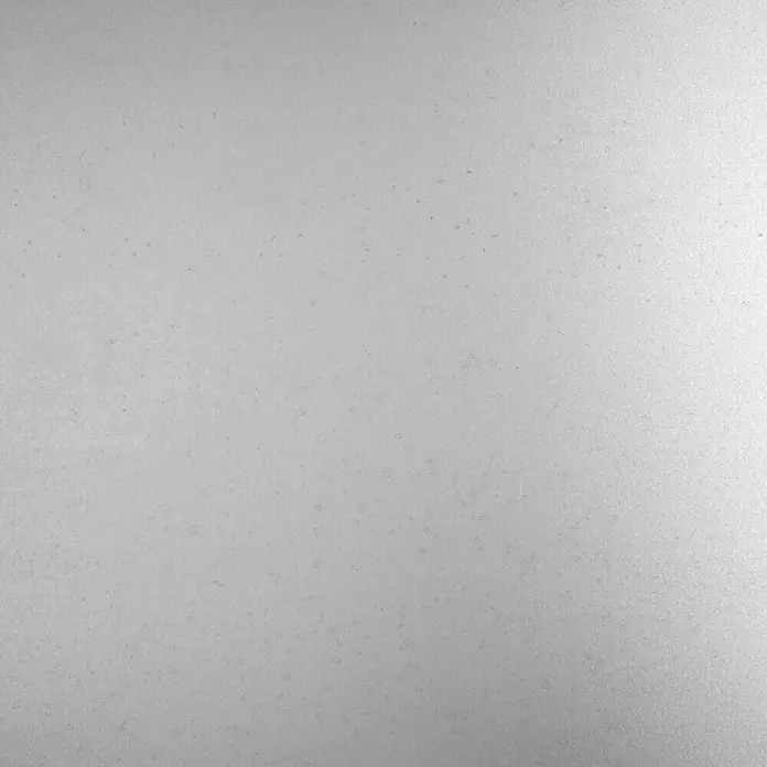 Kantoflex Glattblech - 1.000 x 600 mm, Stärke: 0,75 mm, Stahl, Roh - Detailaufnahme einer subtilen, grauen Textur, die eine schlichte Eleganz und Vielseitigkeit für Designprojekte bietet.