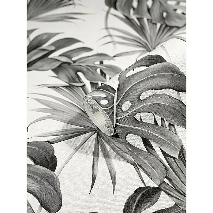 SCHÖNER WOHNEN-Kollektion New Spirit Vliestapete Fensterblatt - Anthrazit, Floral, 10,05 x 0,53 m - Nahaufnahme einer Rolle Tapete mit großem Monstera- und Palmblattmuster in Schwarzweiß.